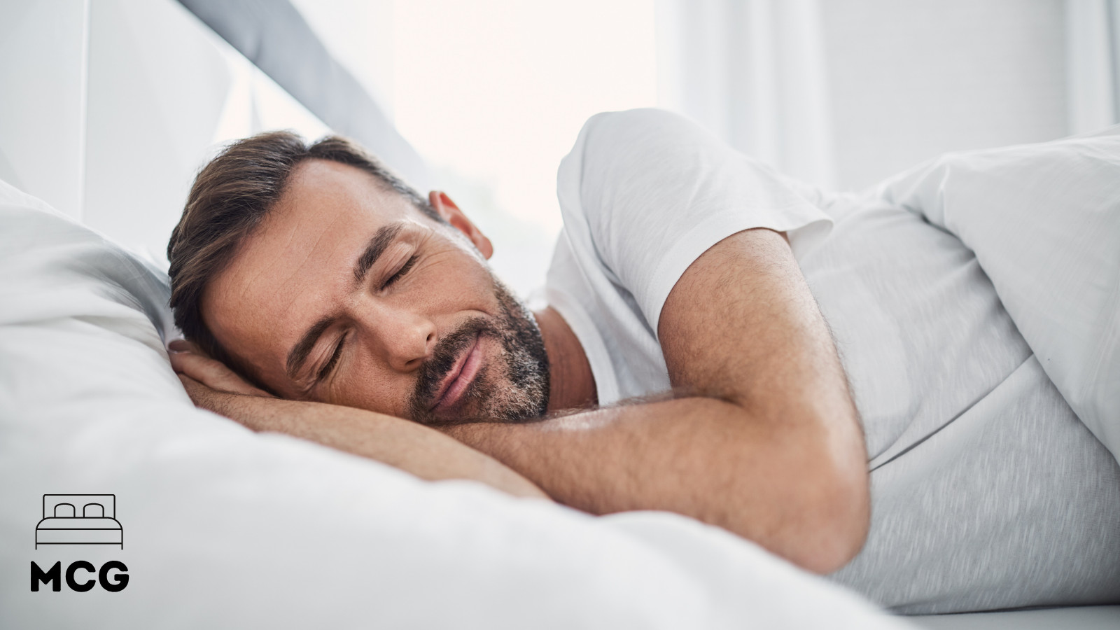 man going to sleep in his bed