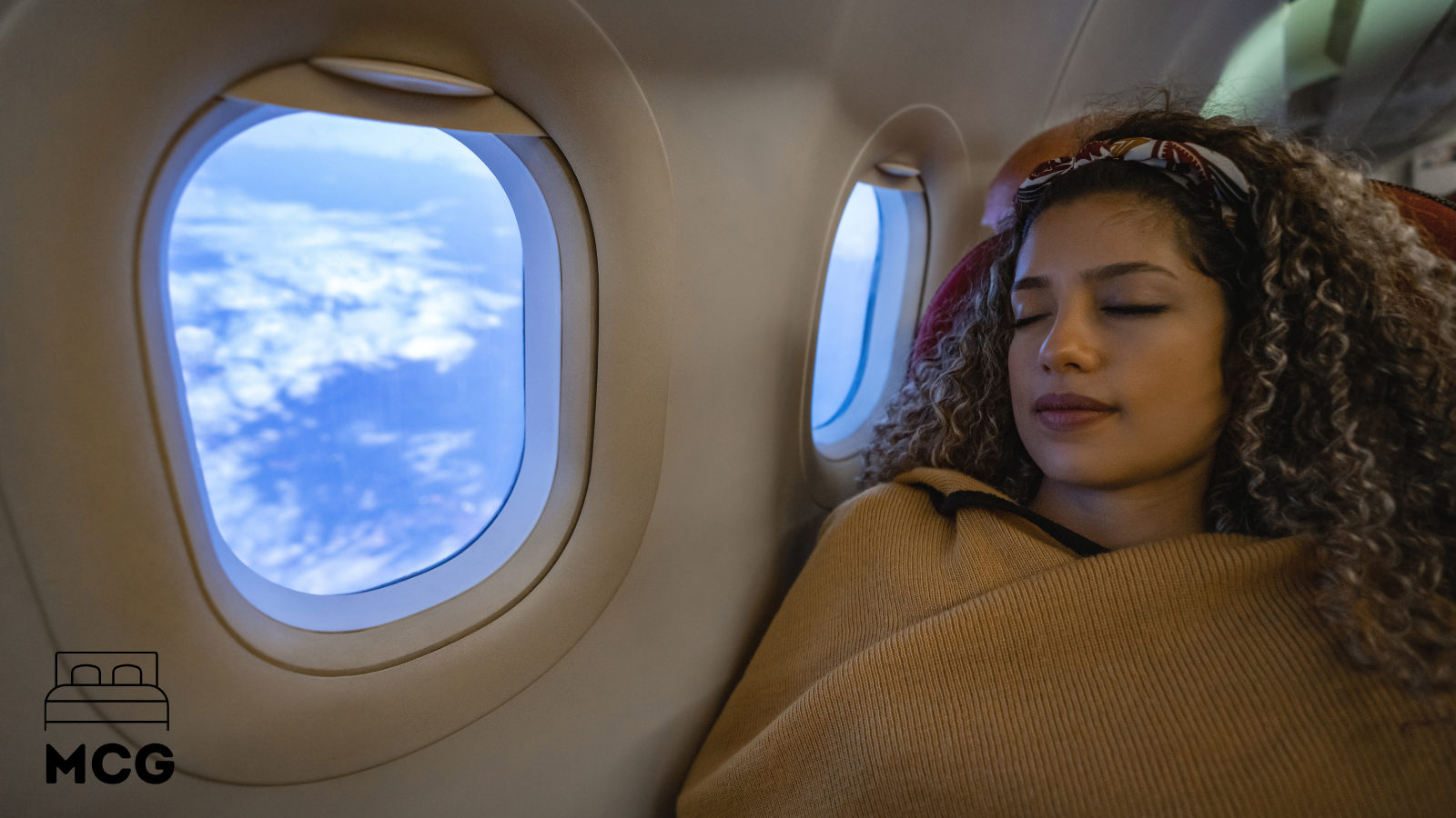 lady sleeping on an airplane