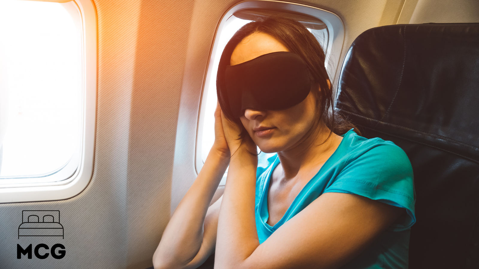woman sleeping on a plane by window