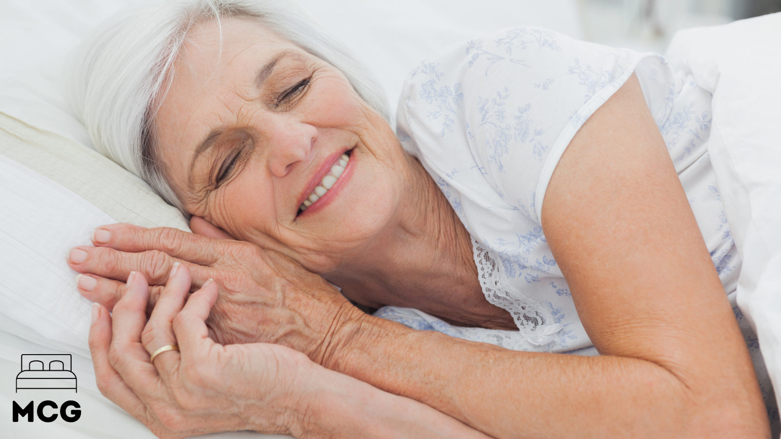 elderly lady comfortable in bed