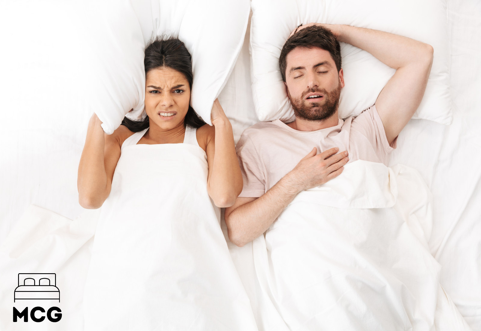 couple in bed man snoring