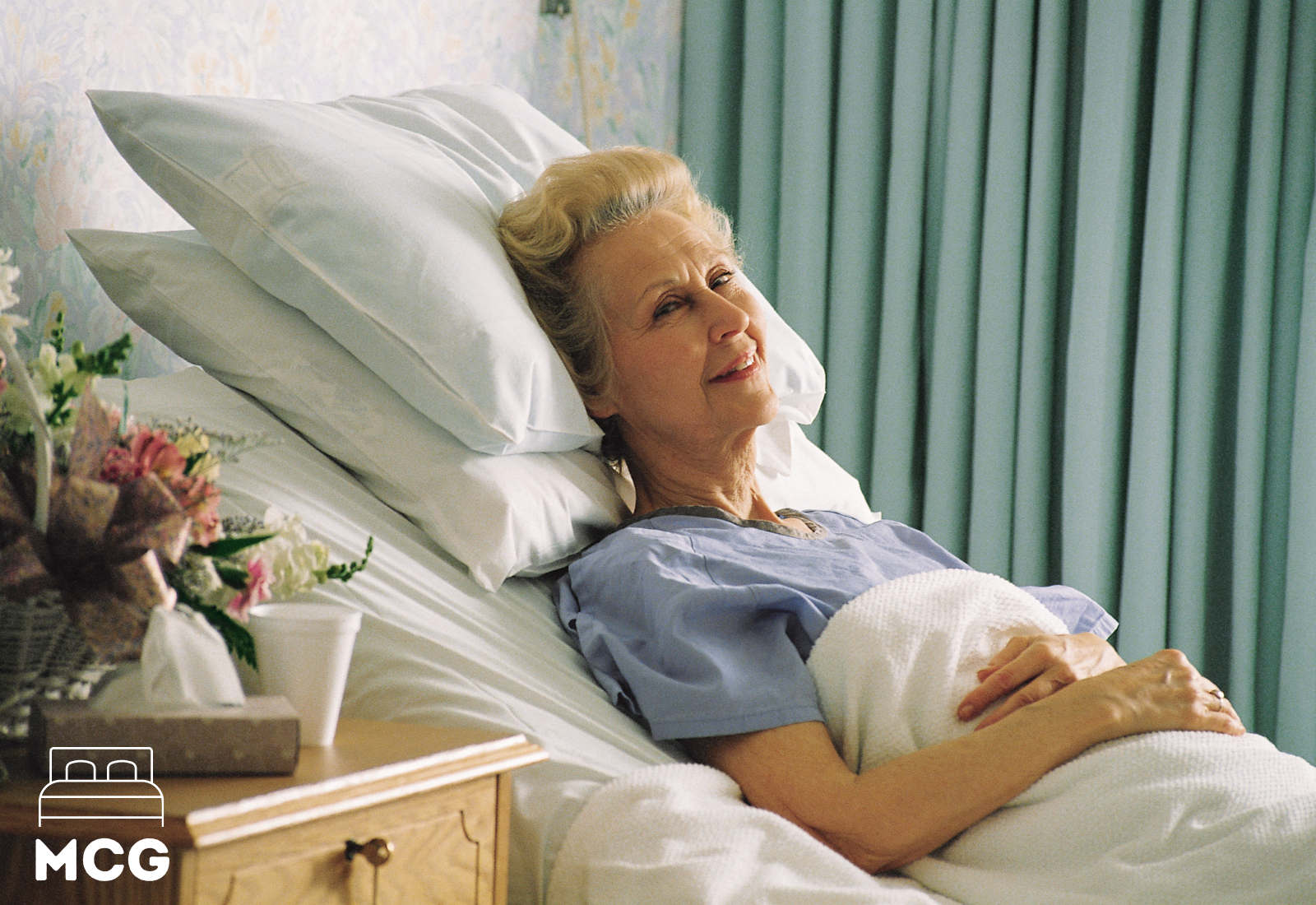 elderly lady in an adjustable bed