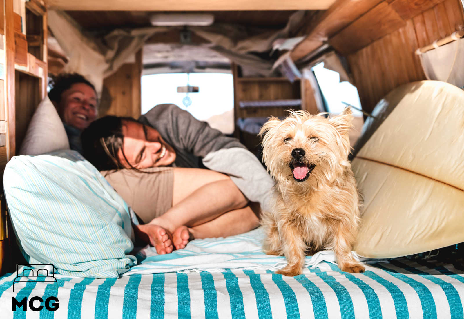 a man woman and dog in an rv camper van
